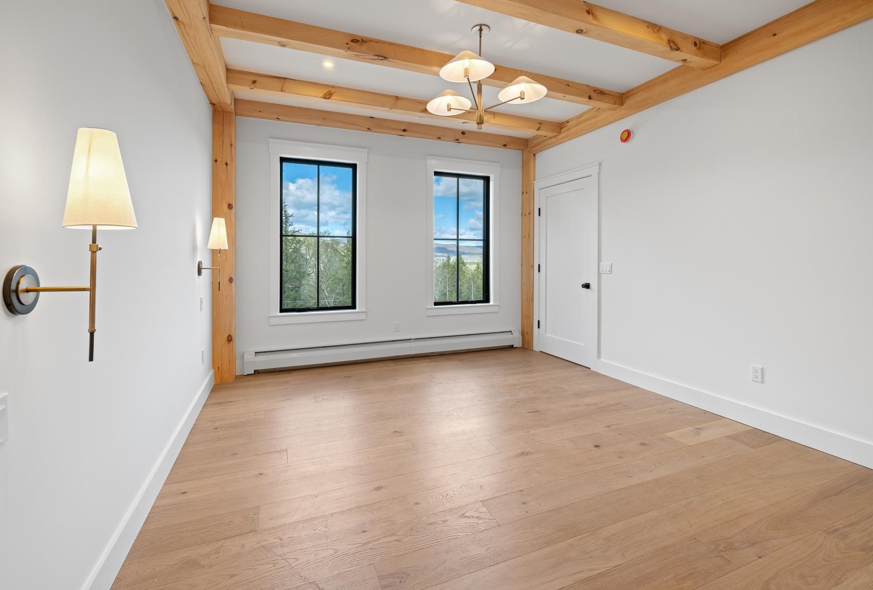 Primary suite with windows overlooking the mountains