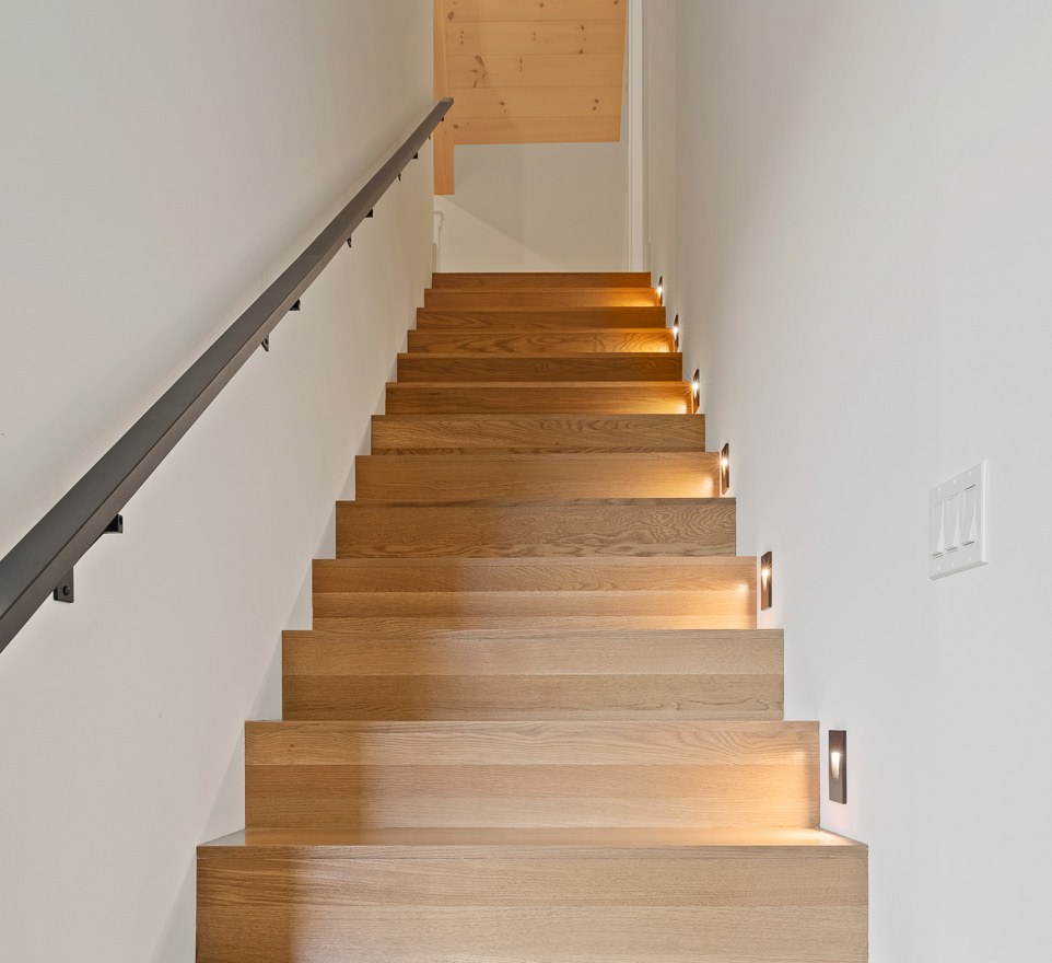 Wood staircase leading to the top level