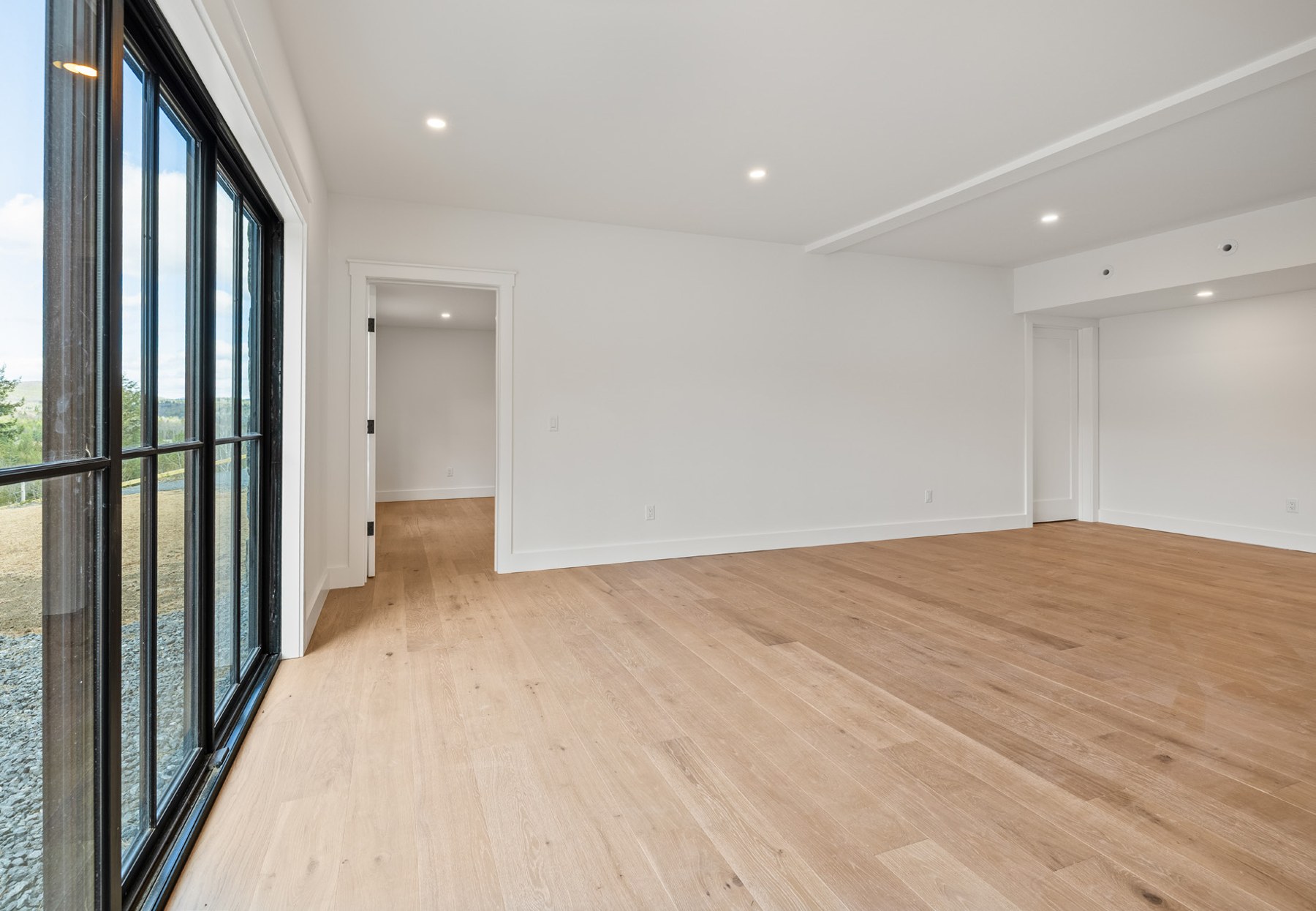 Media room with large glass doors to the outdoors